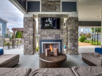 Outdoor fireplace with lounge area
